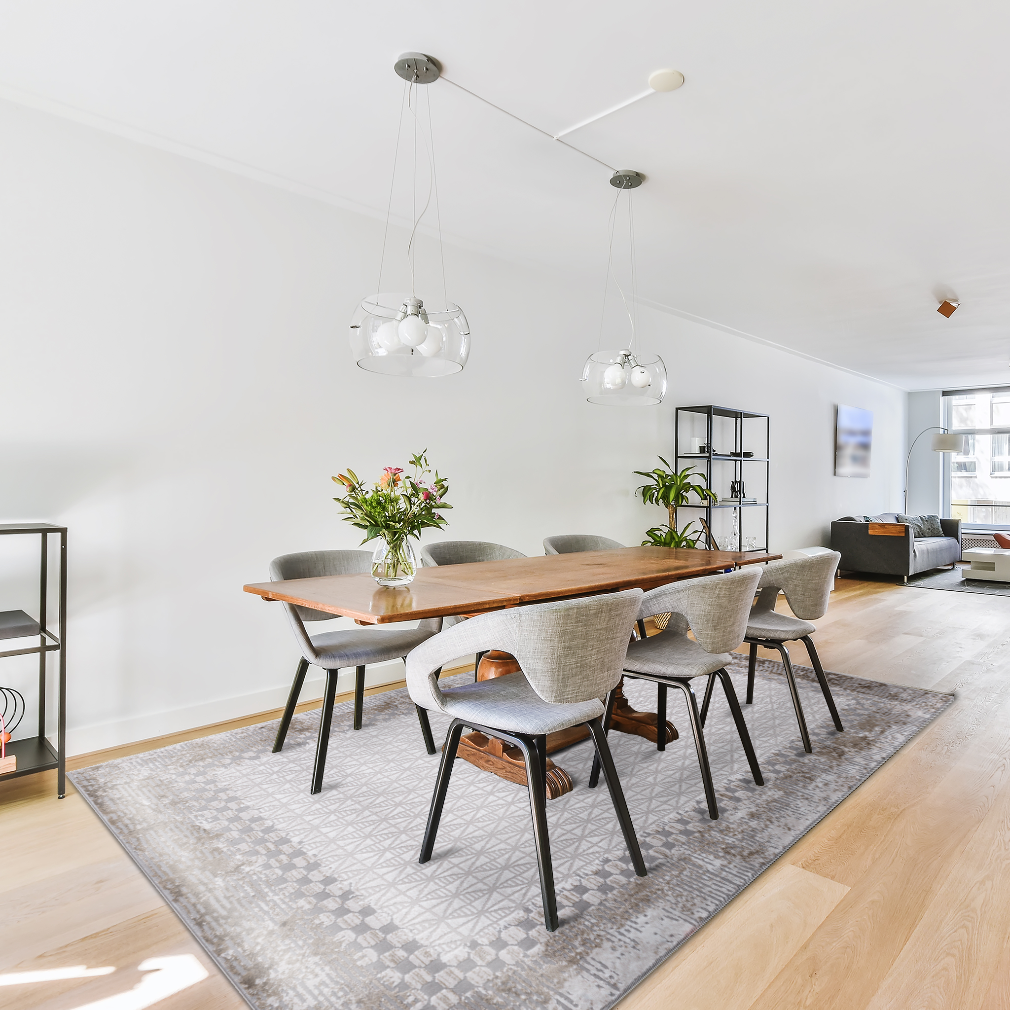 Modern open concept home with minimalist dining area, featuring dark wooden table and grey chairs on Geometric Beige Rug 